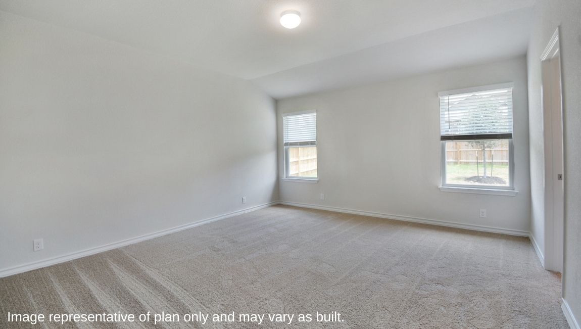 Primary bedroom located off family room with ensuite bathroom and quality carpet.