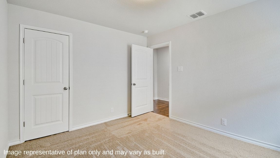 Third bedroom with quality carpet, closet and window.