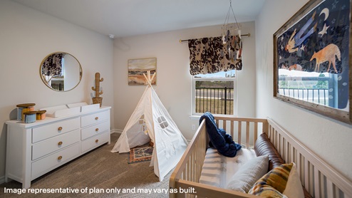fourth bedroom with carpet flooring and window
