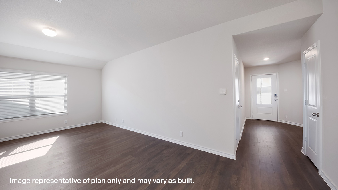 Open-concept family room with large window providing plenty of natural lighting.