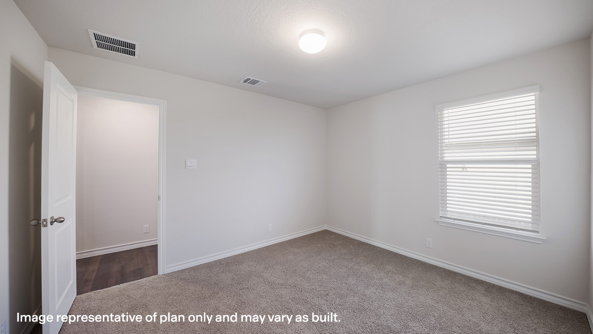 Secondary bedroom with quality carpet, window and closet.