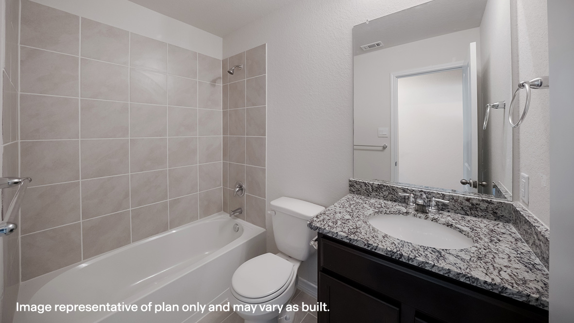 Second full bathroom with combined bathtub and shower, toilet and hard surface flooring.