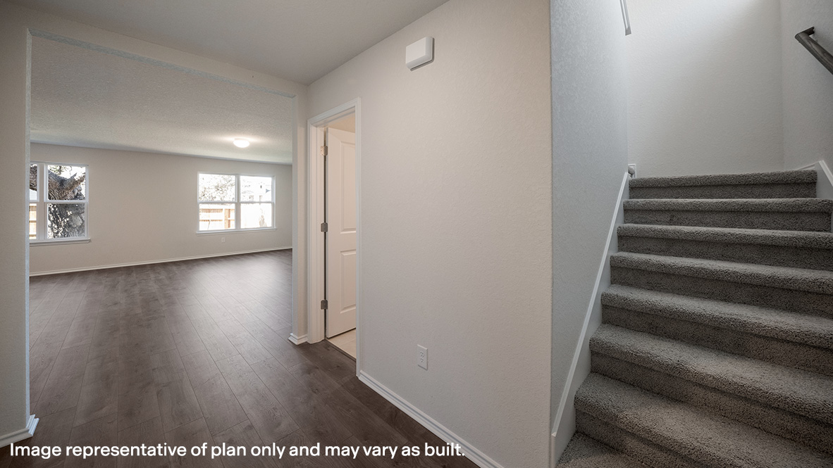 Foyer entry with attached powder room.
