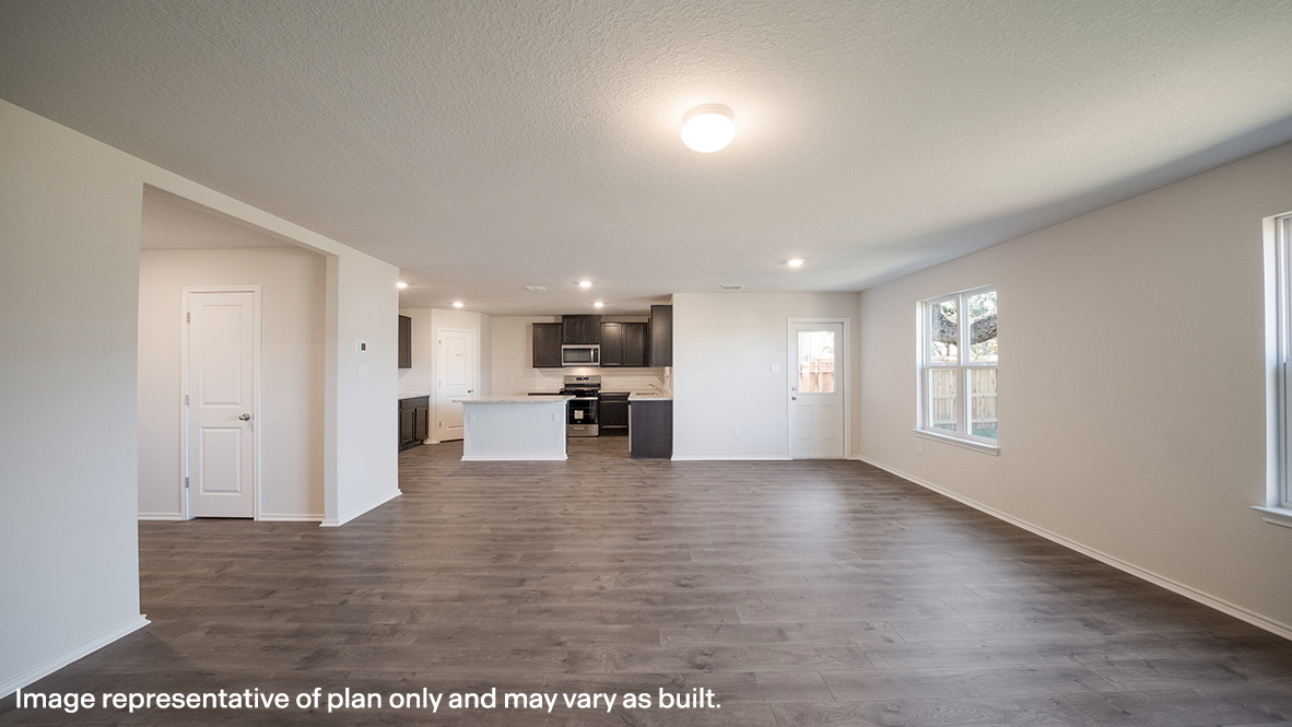 Spacious living area overlooking kitchen.