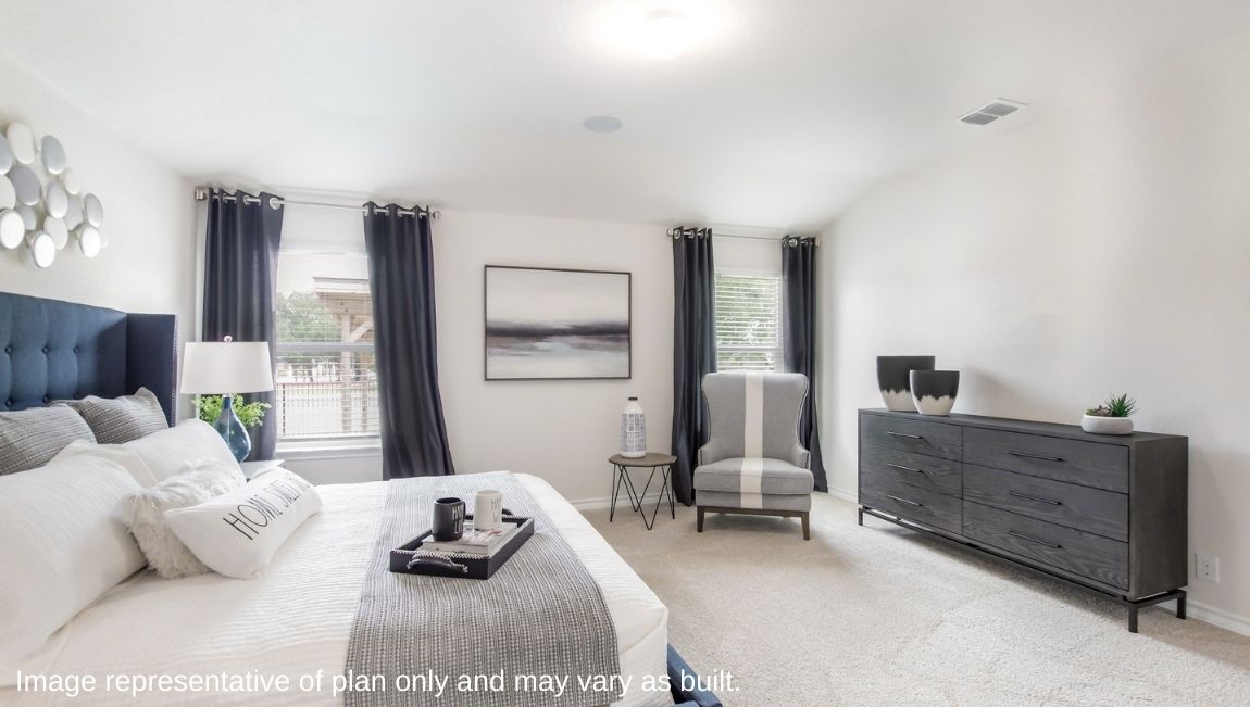 Spacious primary bedroom located off family room with ensuite bathroom.