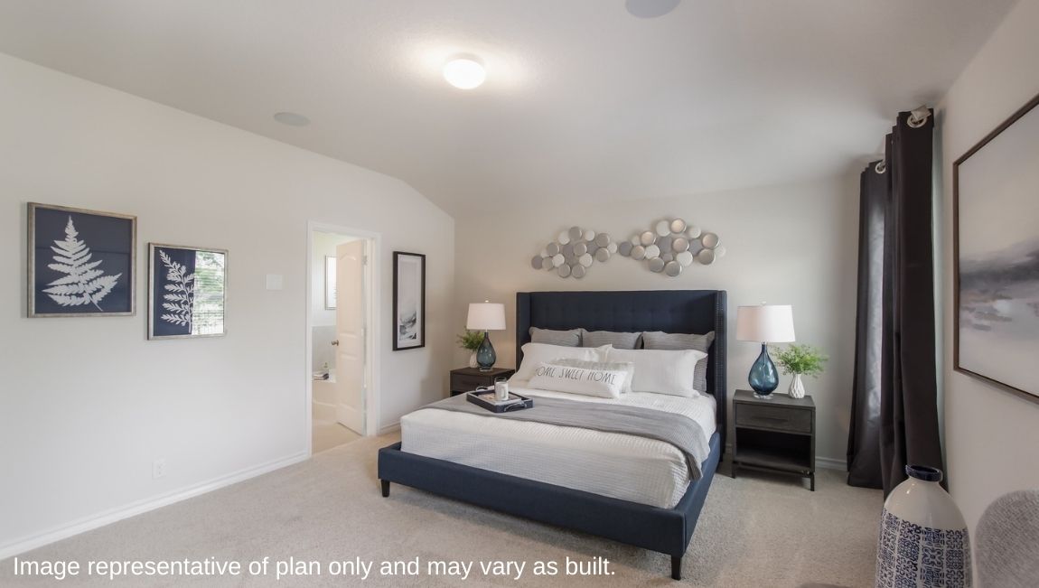 Spacious primary bedroom with quality carpet and large windows providing plenty of natural light.