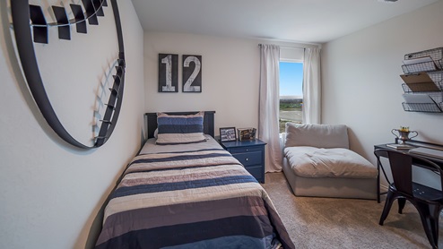 Secondary bedroom with quality carpet, window and closet.