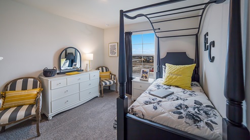 Fourth bedroom with quality carpet, window and closet.