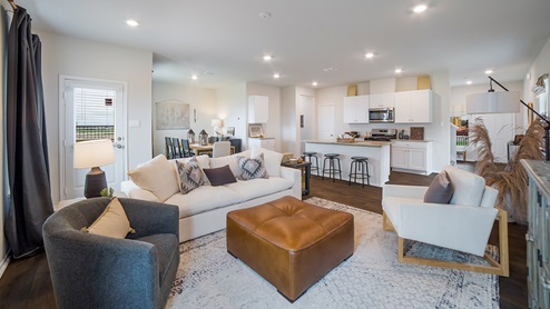 Open concept living room, kitchen and dining room with hard surface flooring throughout