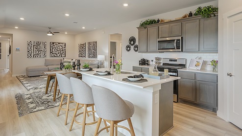Midtown Model Kitchen with quarts countertops and gray shaker cabinetry.