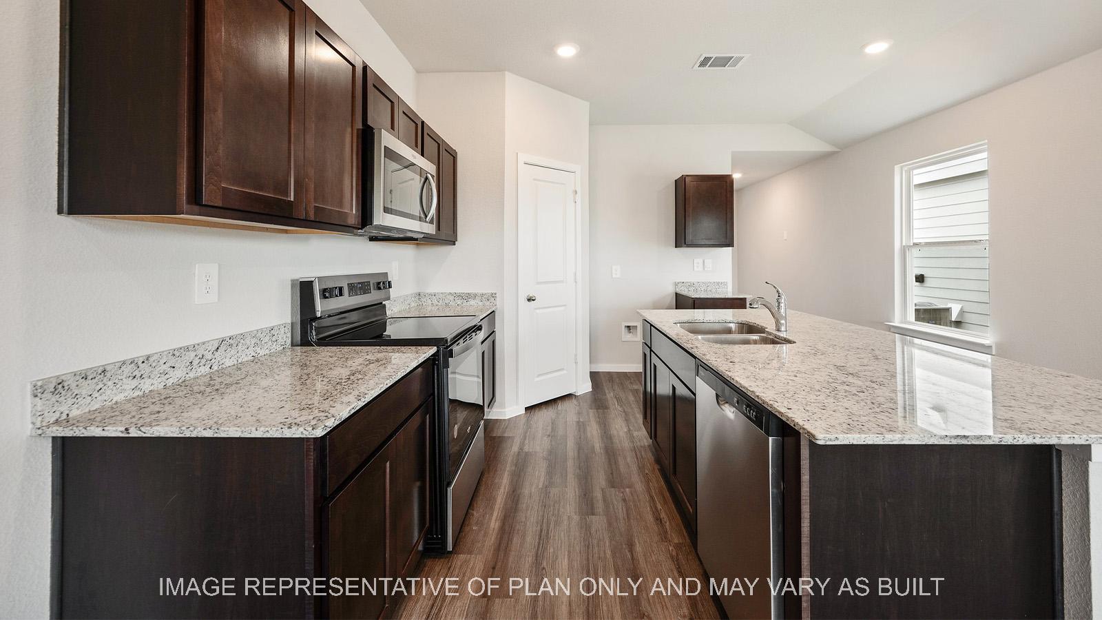 Amber kitchen with corner pantry, galley island, and stainless steel appliances.