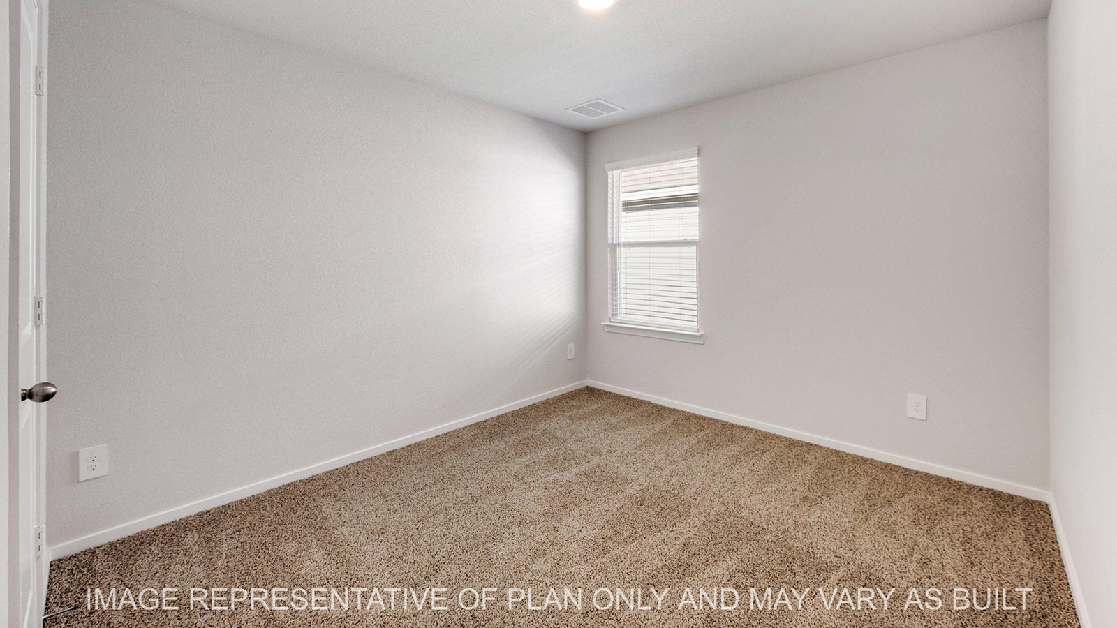 Brooke secondary bedroom with window and carpeted flooring.