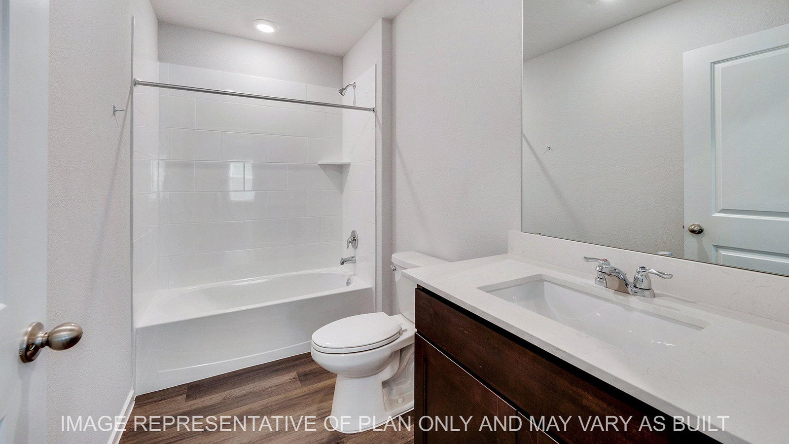 Brooke secondary bathroom with vinyl plank flooring and quarts countertops.