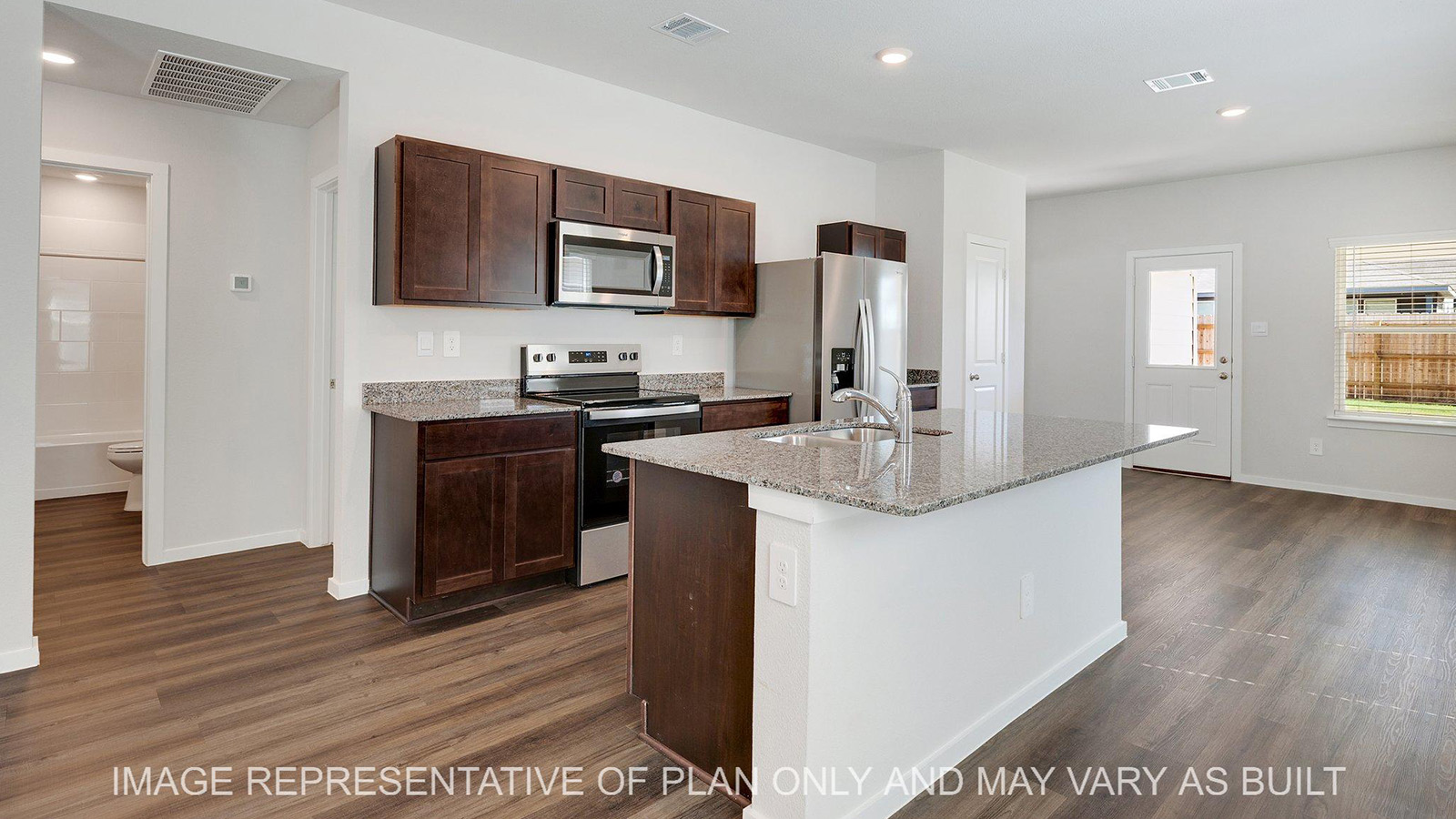 Brooke kitchen with dark brown stained cabinetry, vinyl plank flooring, and granite countertops.