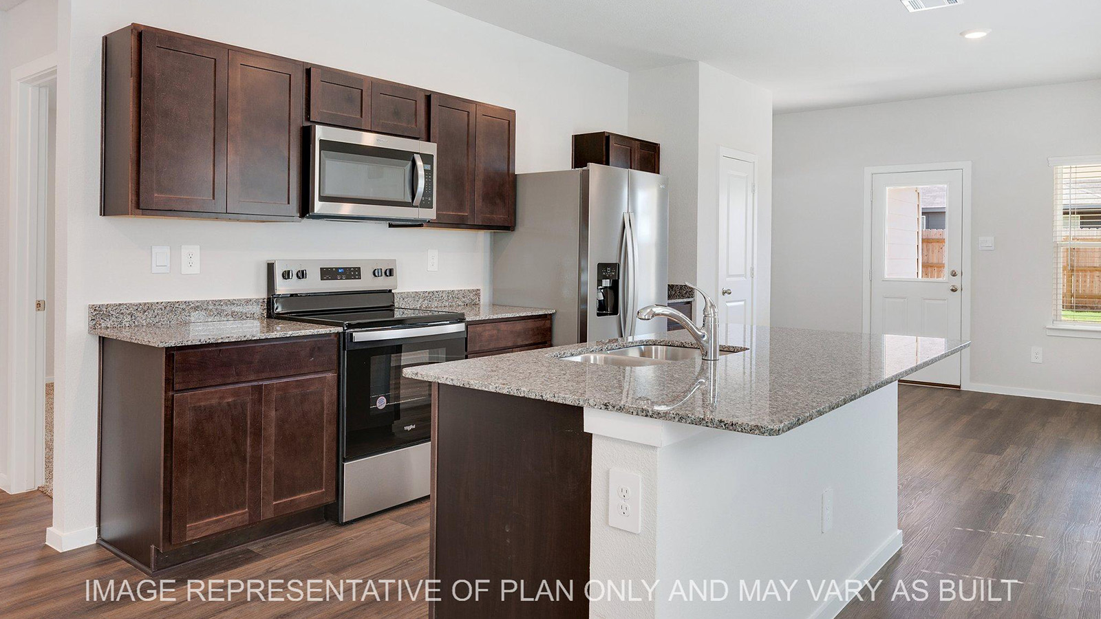 Brooke kitchen with dark brown stained cabinetry, vinyl plank flooring, and granite countertops.