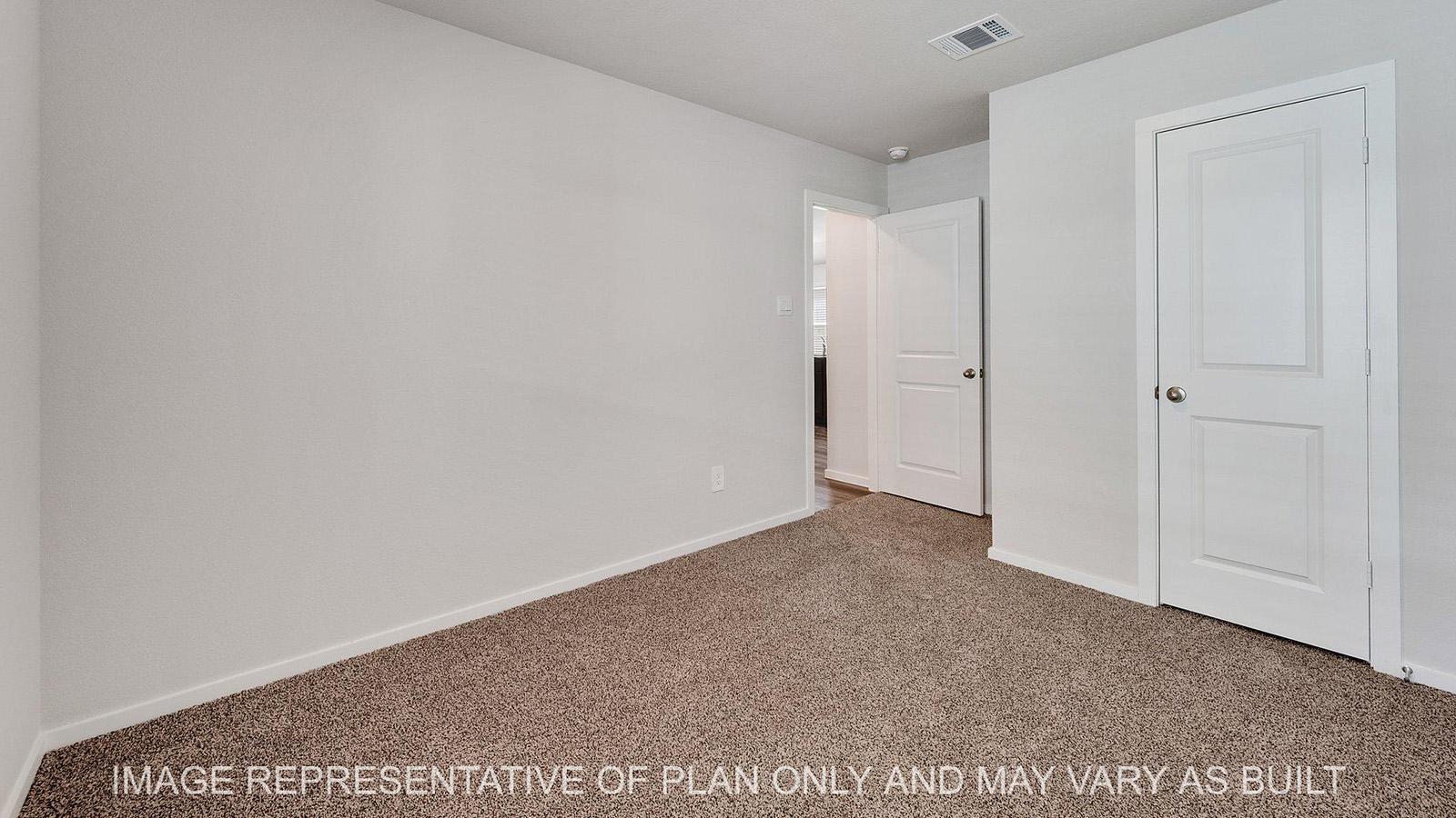 Brooke secondary bedroom with carpeted flooring and closet.
