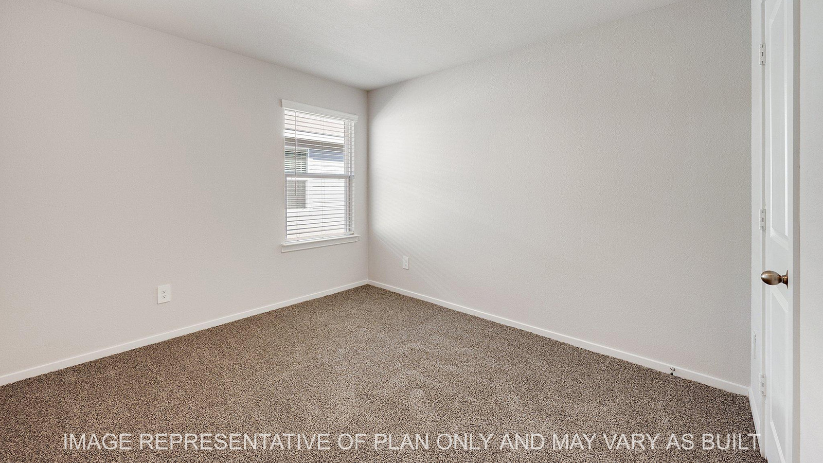 Brooke secondary bedroom with carpeted flooring and window.