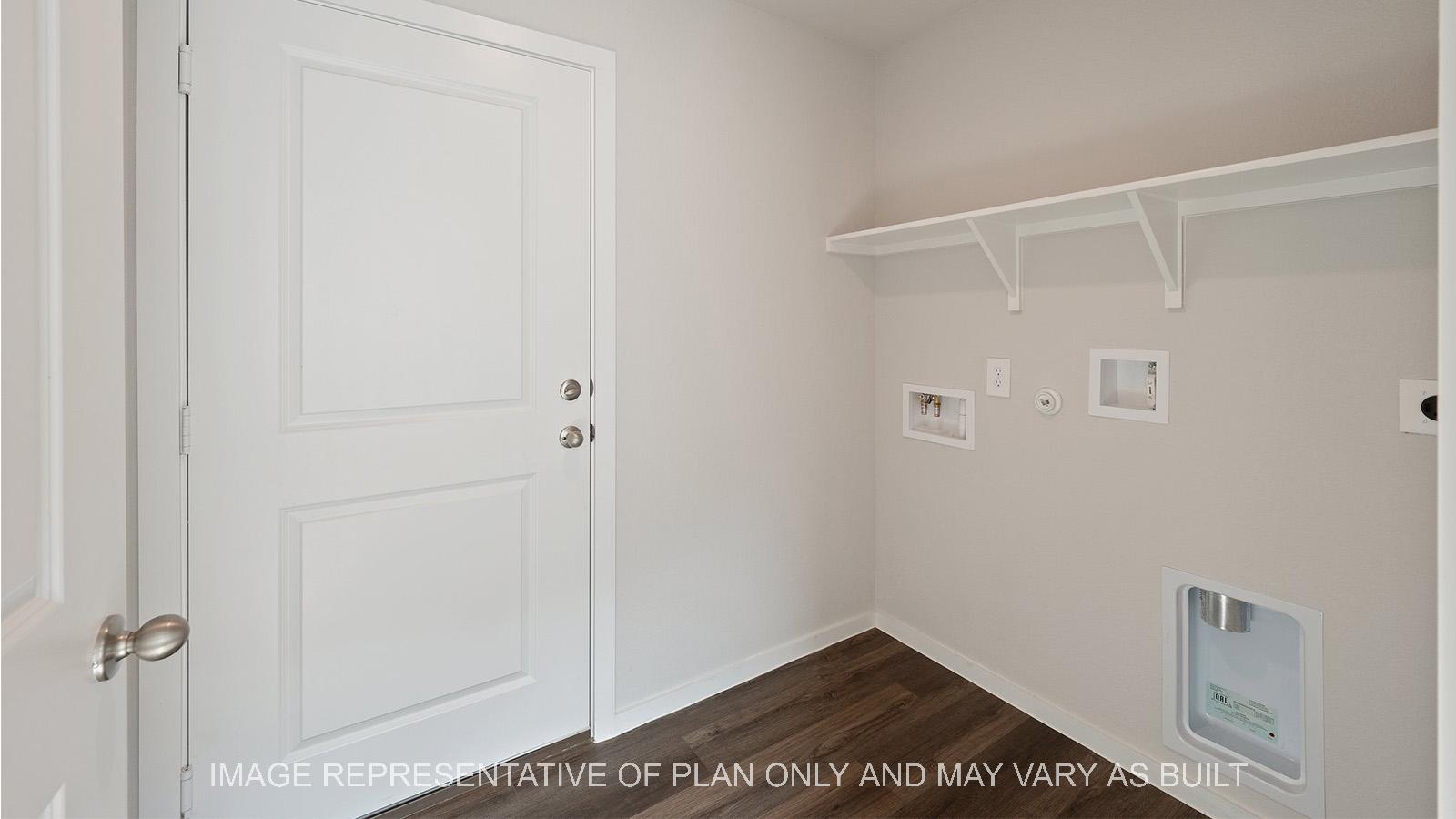 Caroline utility room with vinyl plank flooring.
