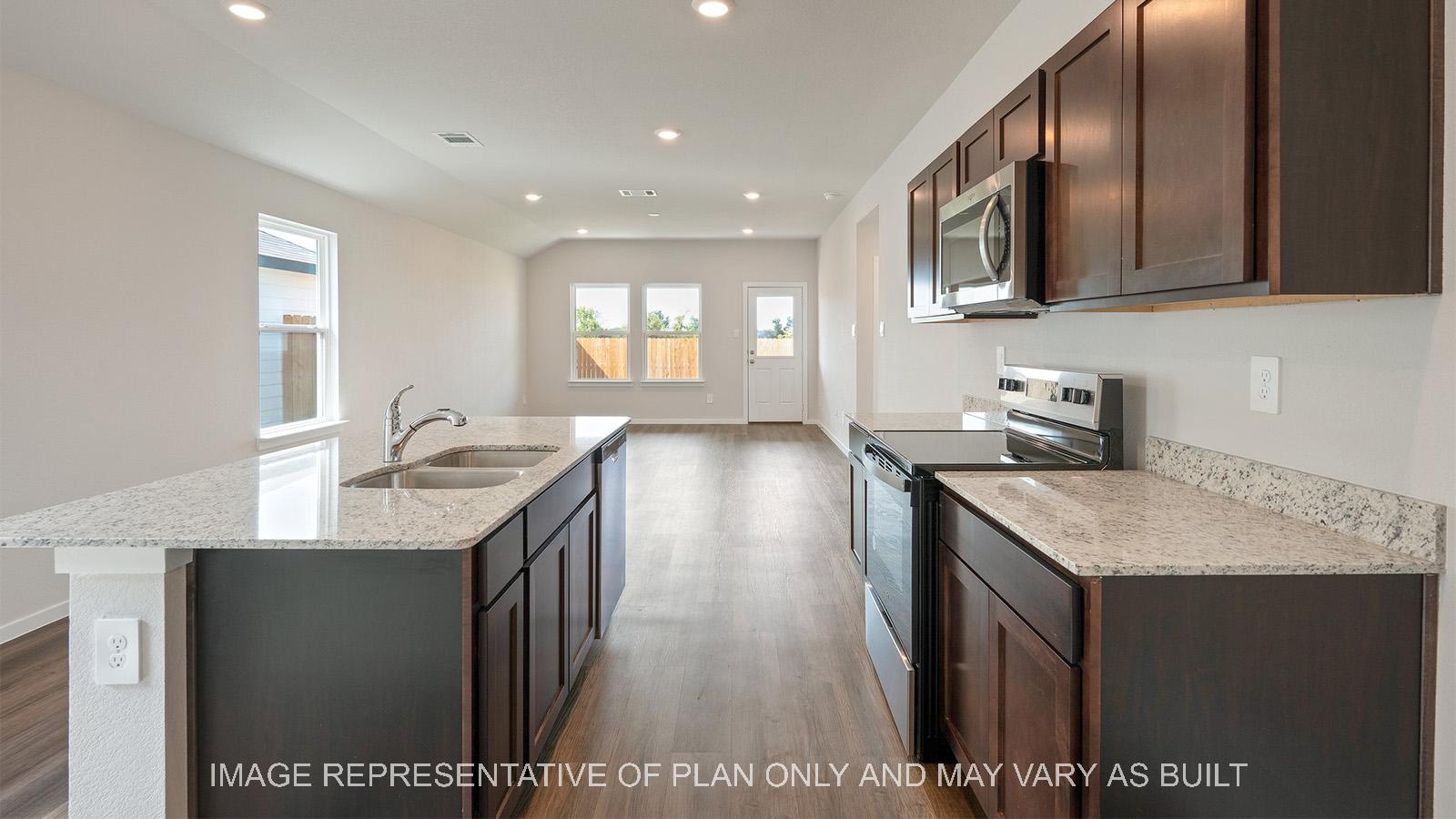 Caroline kitchen with window and view to back door.