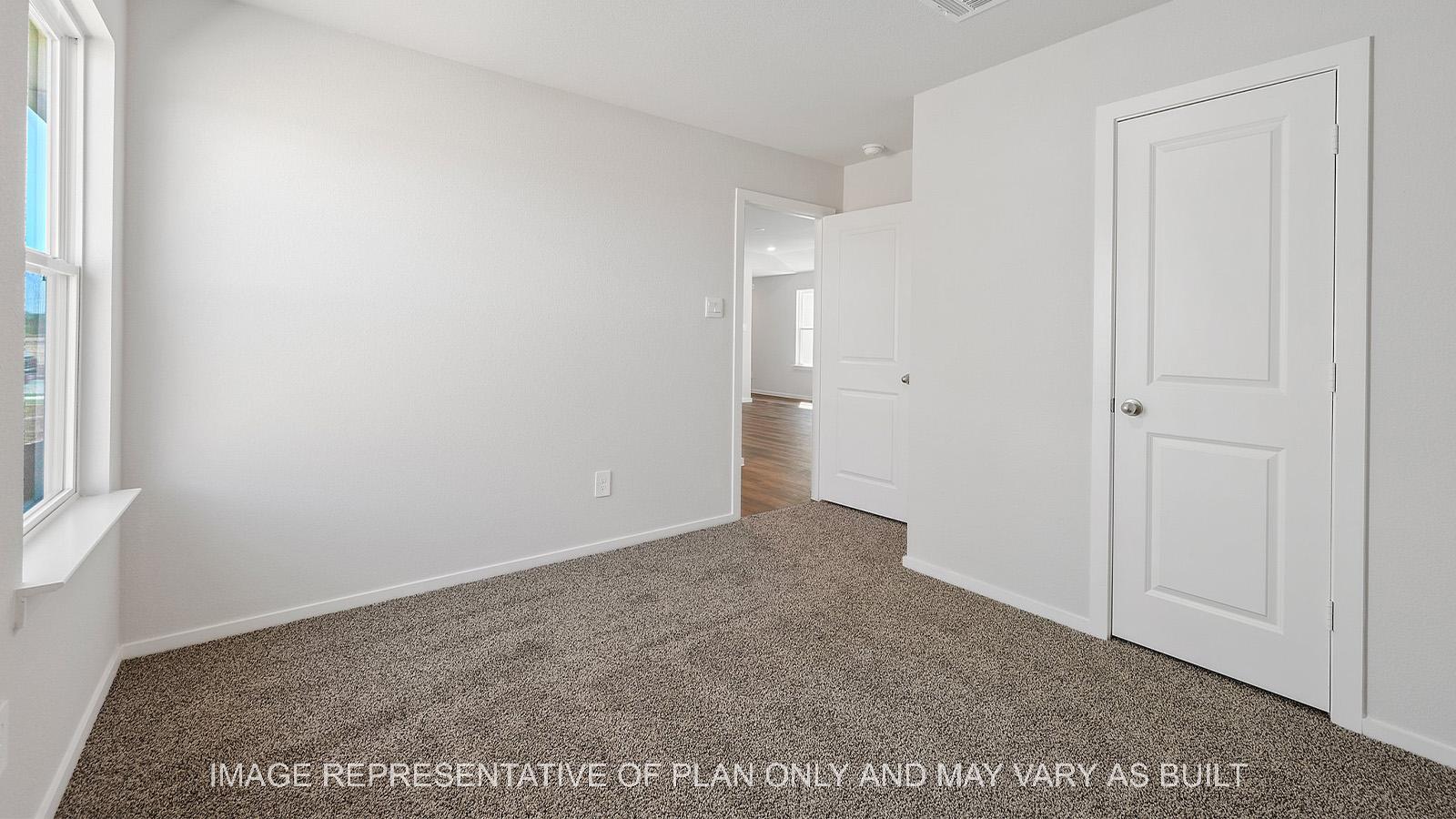 Diana secondary bedroom with carpeted flooring, closet, and window.