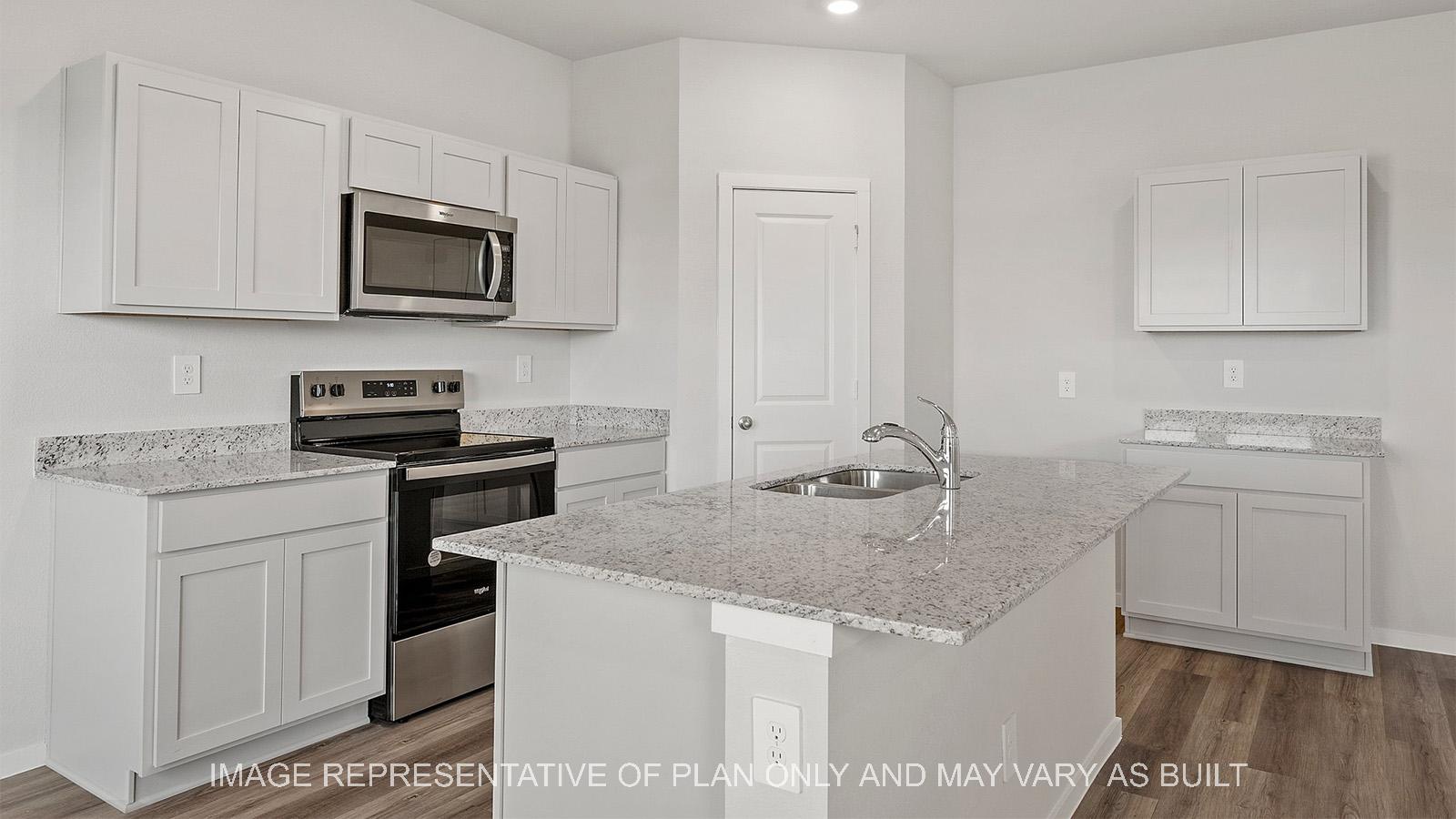 Emma kitchen with white shaker cabinetry, granite countertops, and light vinyl plank flooring.