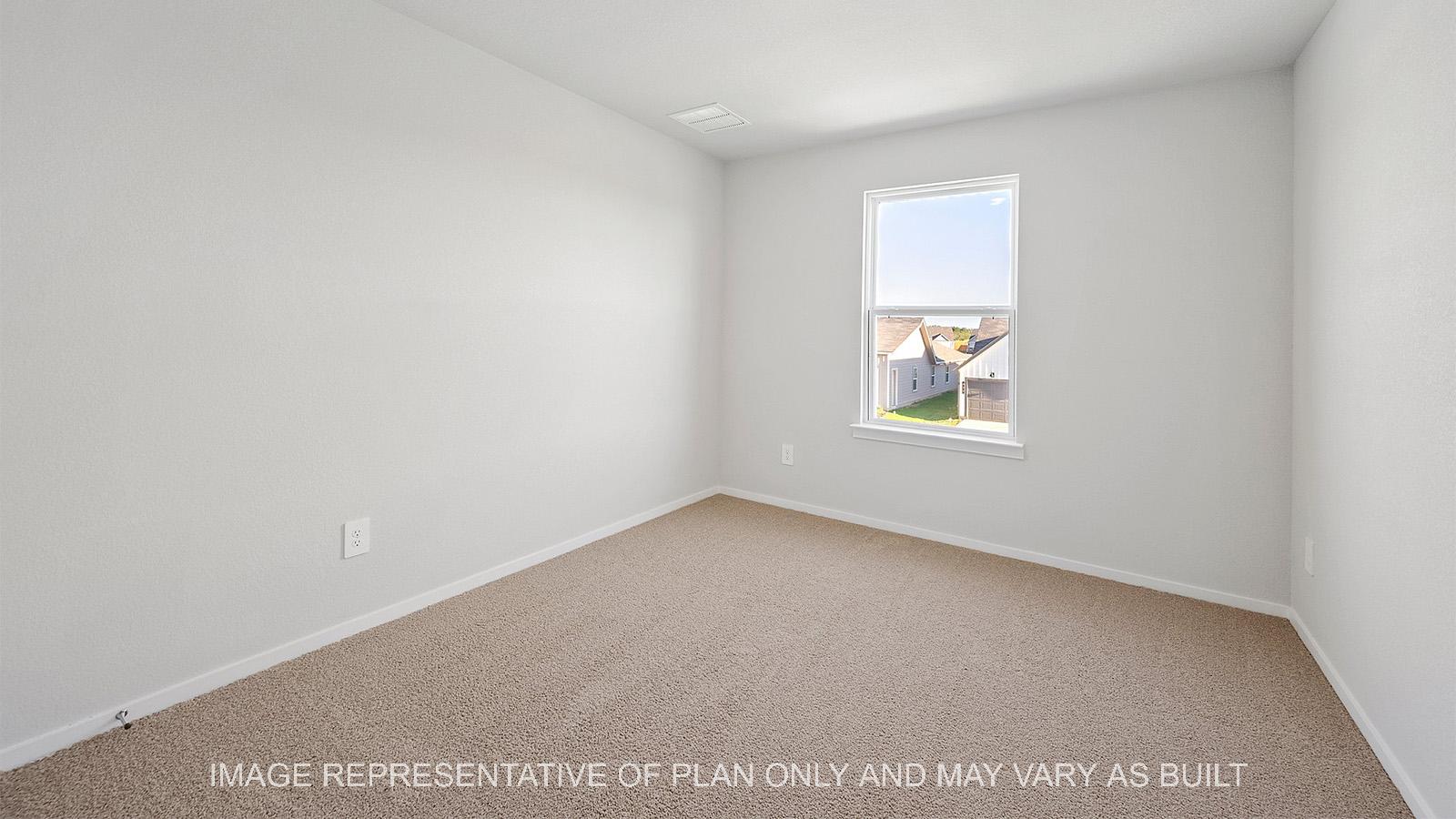Emma secondary bedroom with carpeted flooring and window.