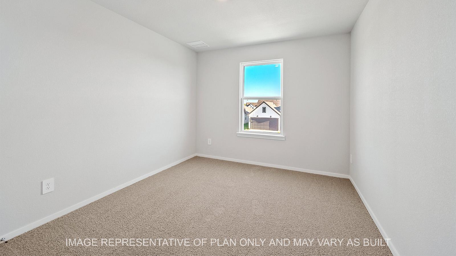 Emma secondary bedroom with window and carpeted flooring.