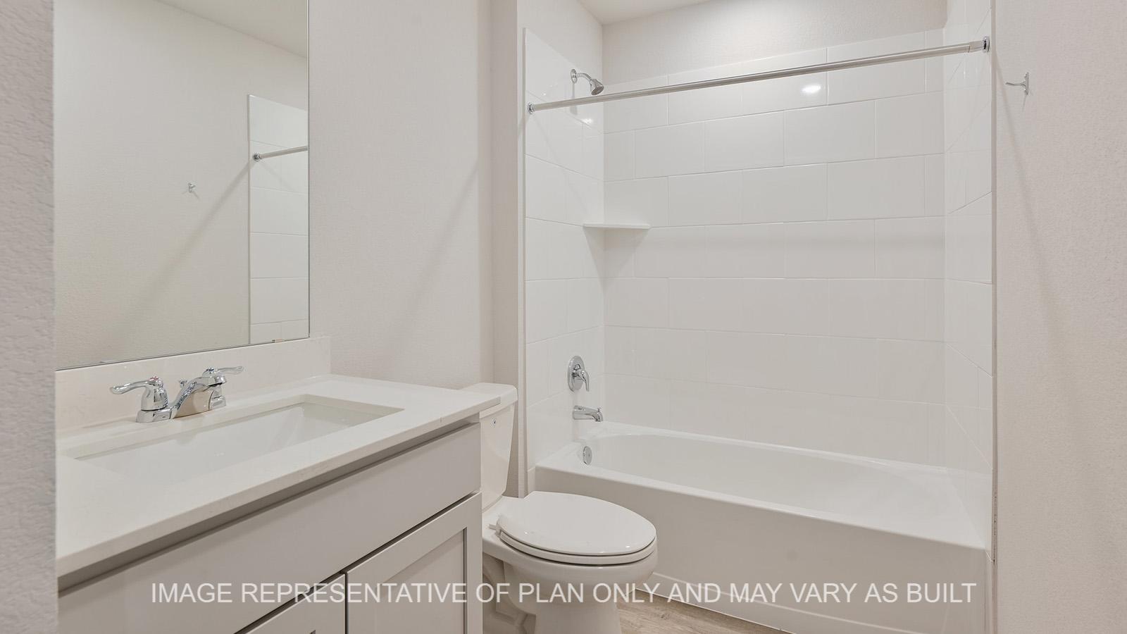 Jasmine secondary bathroom with granite countertops, ceramic tile shower tub surround, and vinyl plank flooring.