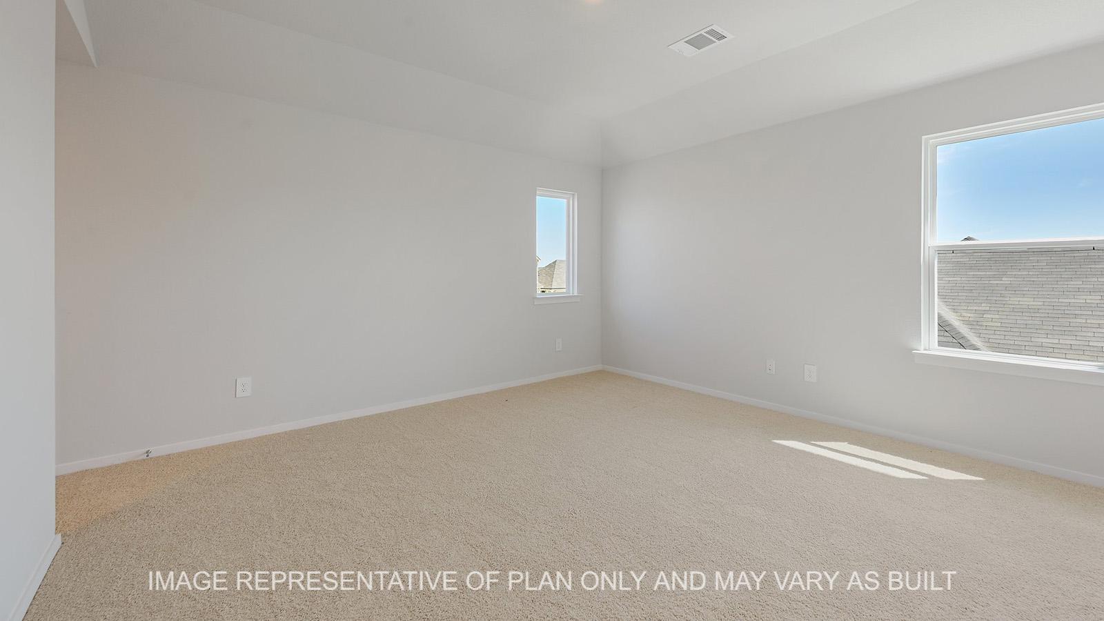 Jasmine upstairs loft with windows and carpeted flooring.
