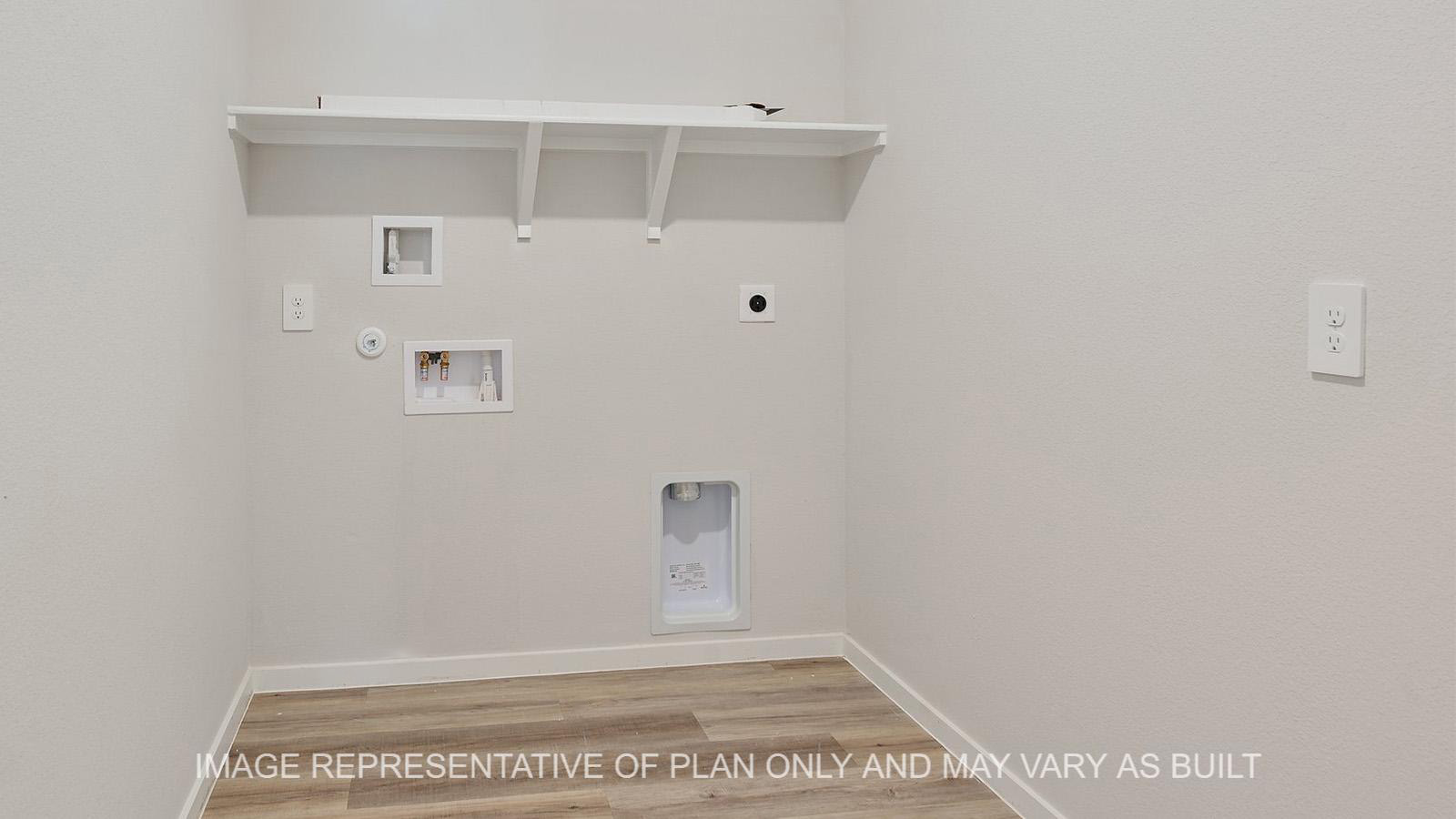 Jasmine utility room with vinyl plank flooring.