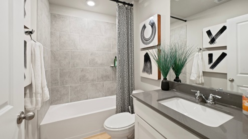 Pleasant Hill Model Home secondary bathroom with quartz countertop.
