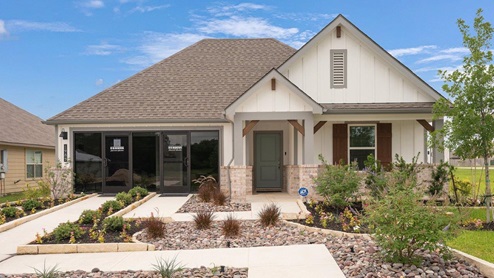 Pleasant Hill Model Home Exterior of a one-story farmhouse home.