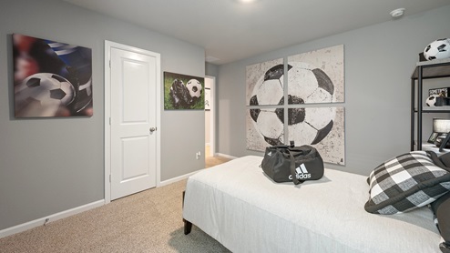 Pleasant Hill Model Home soccer inspired secondary bedroom.