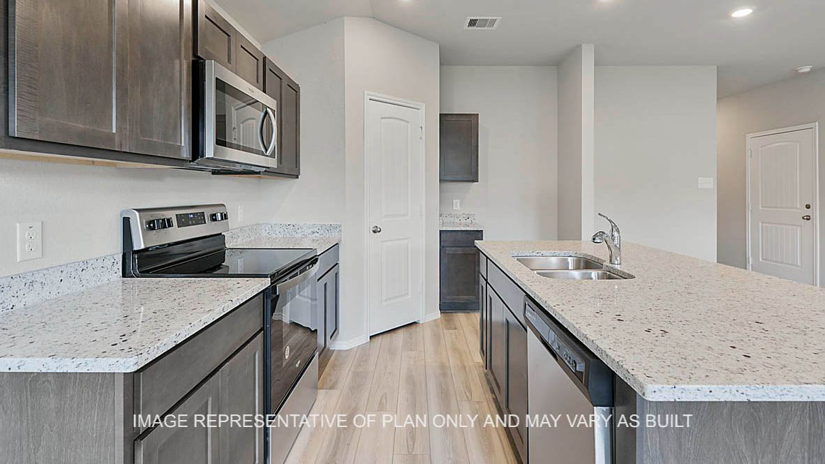 Ashburn kitchen with stained cabinetry, granite countertops, vinyl plank flooring, island and pantry.