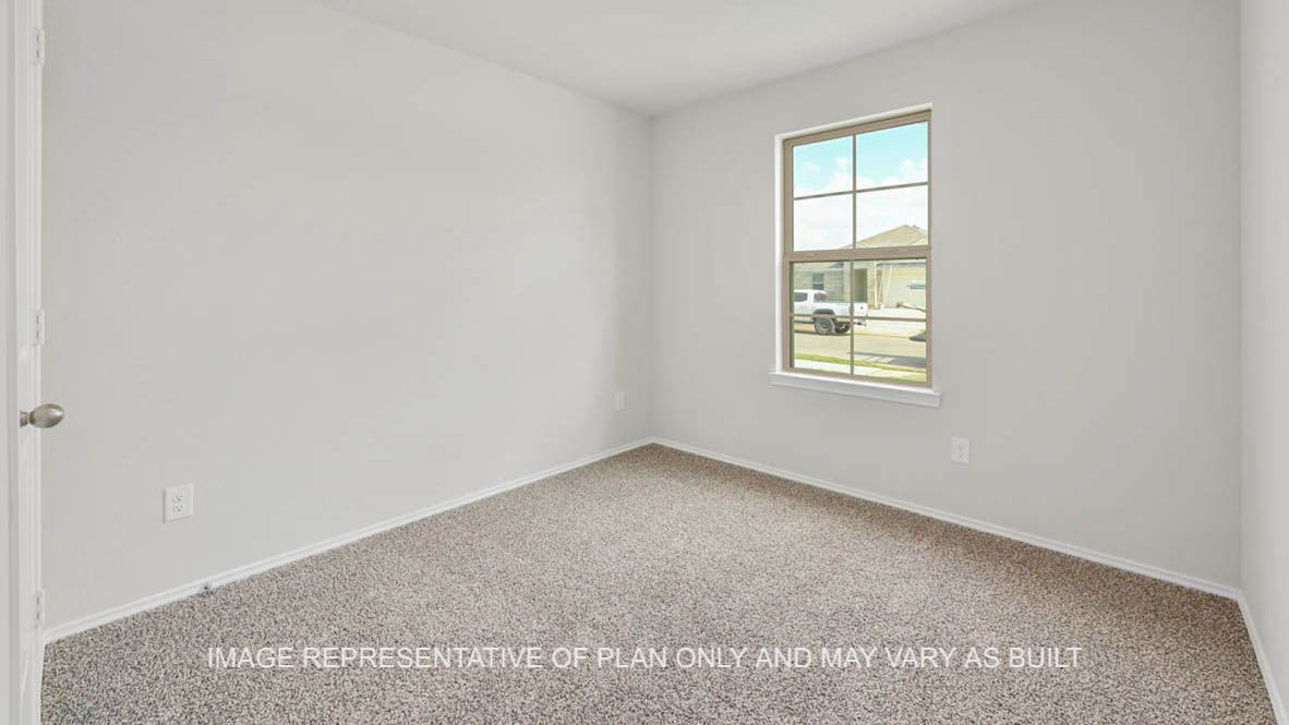 Ashburn secondary bedroom with window and carpeted flooring.