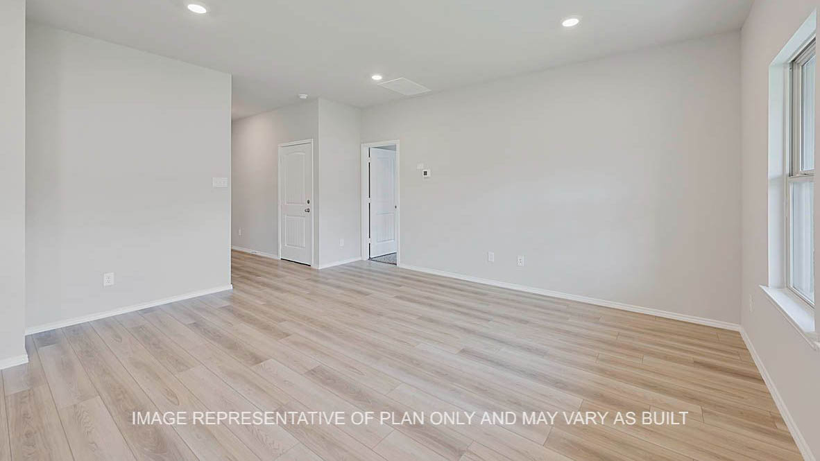 Ashburn open-concept living room with vinyl plank flooring.