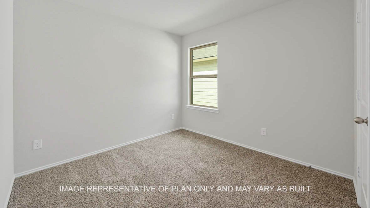 Ashburn secondary bedroom with window and carpeted flooring.