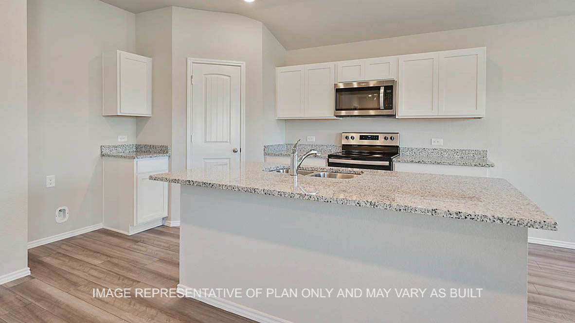 Bellvue kitchen with granite countertops, white cabinetry, and vinyl plank flooring.
