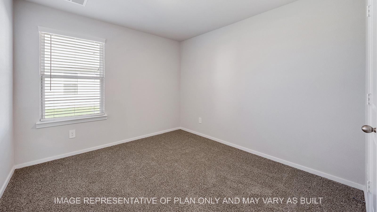 Camden secondary bedroom with window and carpeted flooring.