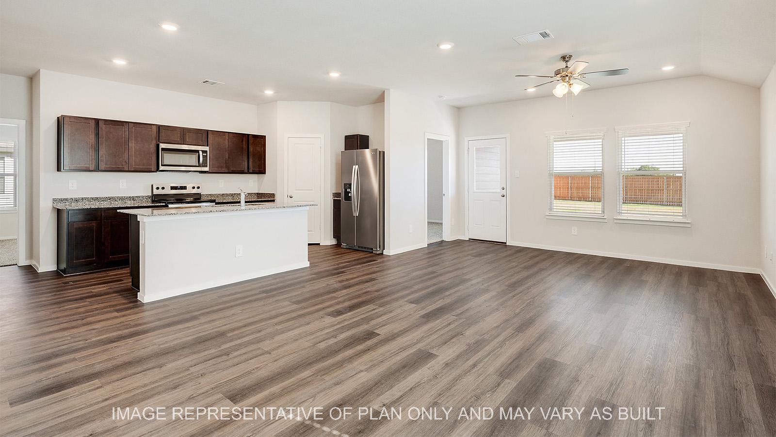 Camden open-concept living room with view to kitchen and master.