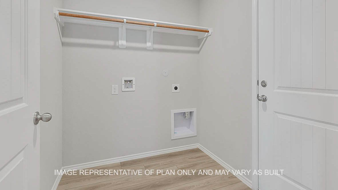 Fargo utility room with vinyl plank flooring.