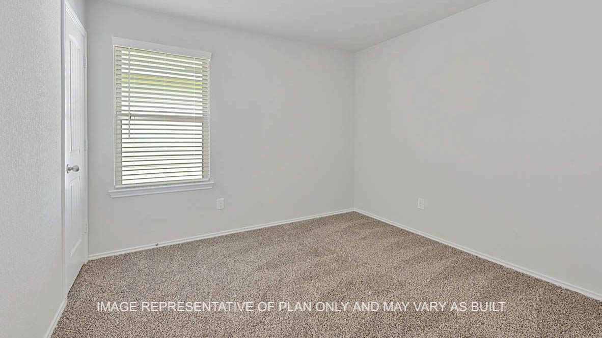 Fargo secondary bedroom with window, carpeted flooring, and closet.