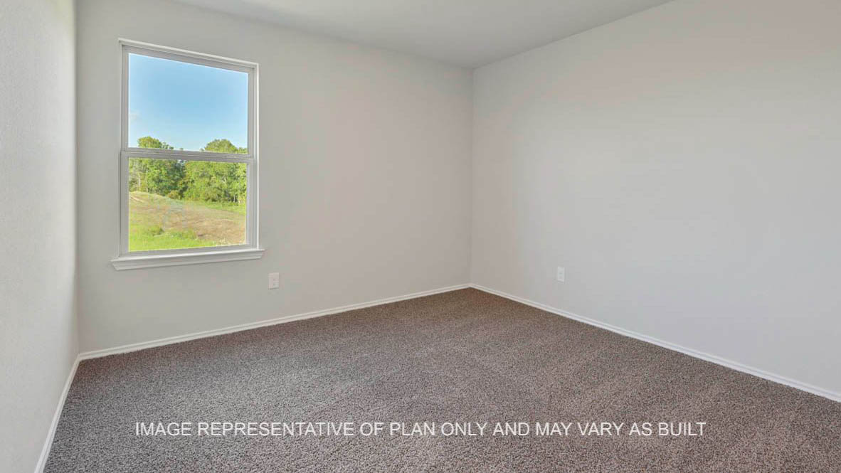 Texas Cali secondary bedroom with window and carpet flooring.