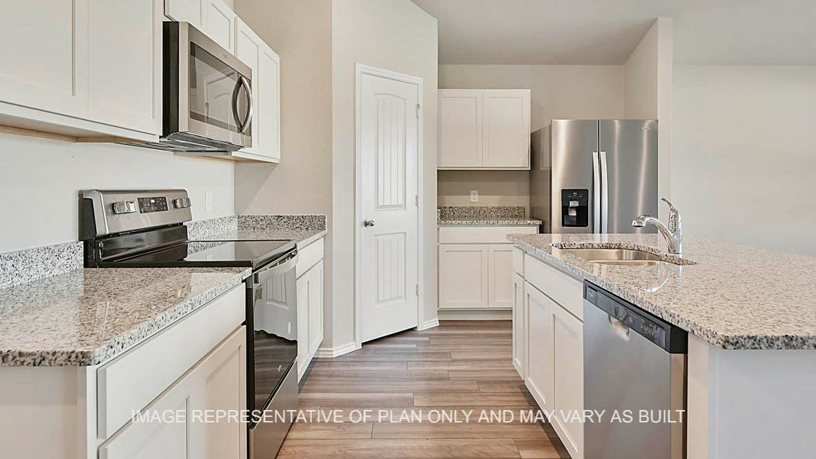 Texas Cali kitchen with white cabinets, granite countertops and vinyl plank flooring.