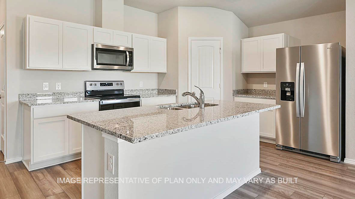 Texas Cali kitchen with white cabinets, granite countertops and vinyl plank flooring.
