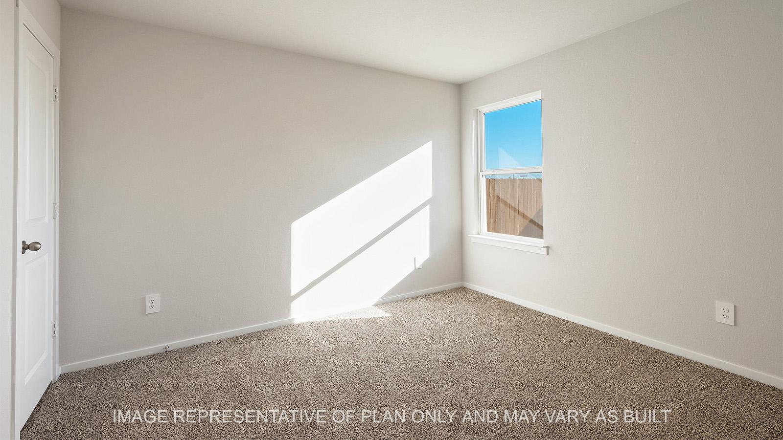 Lakeway secondary bedroom with window, closet, and carpeted flooring.