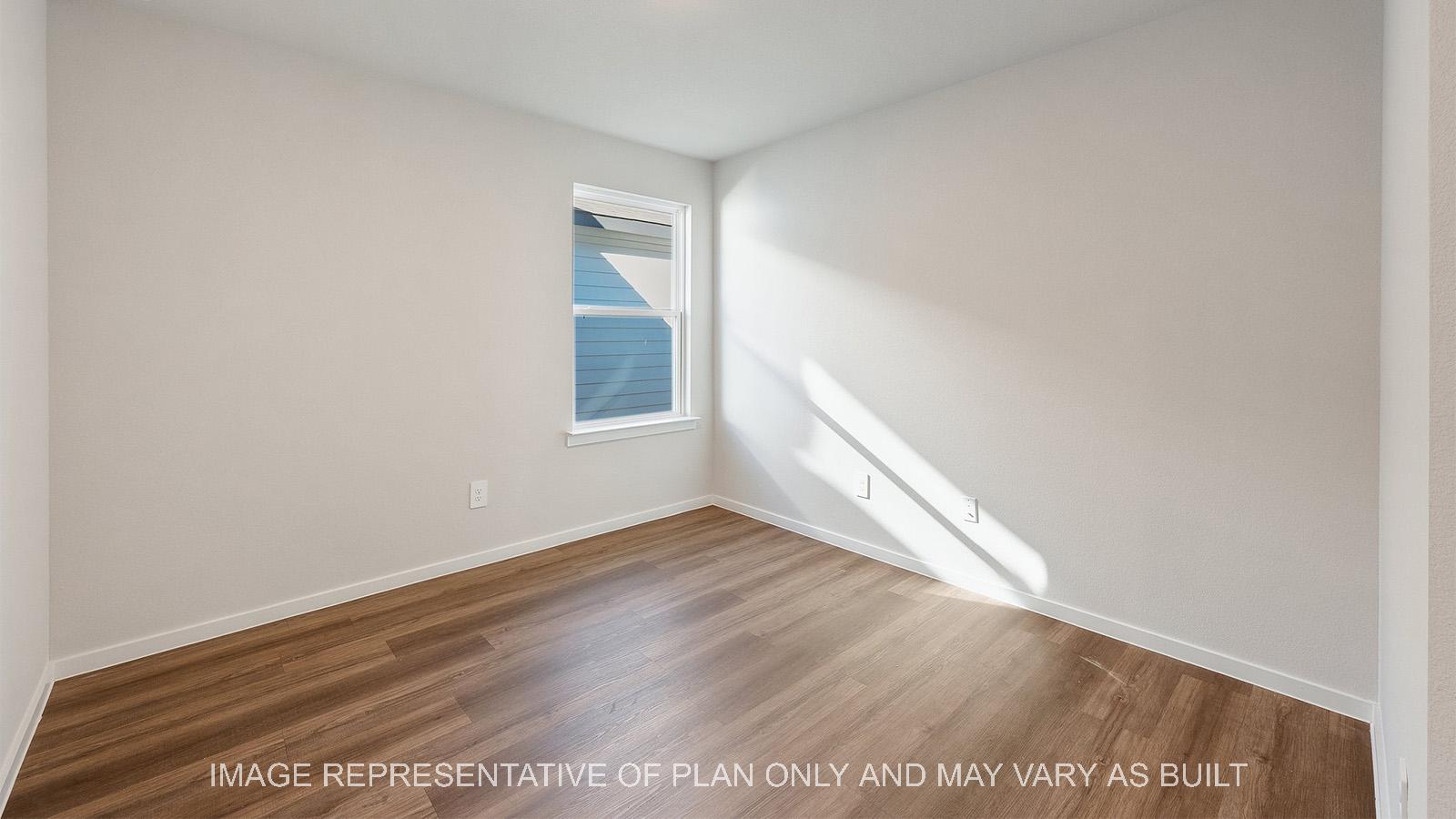 Lakeway study with vinyl plank flooring and window.