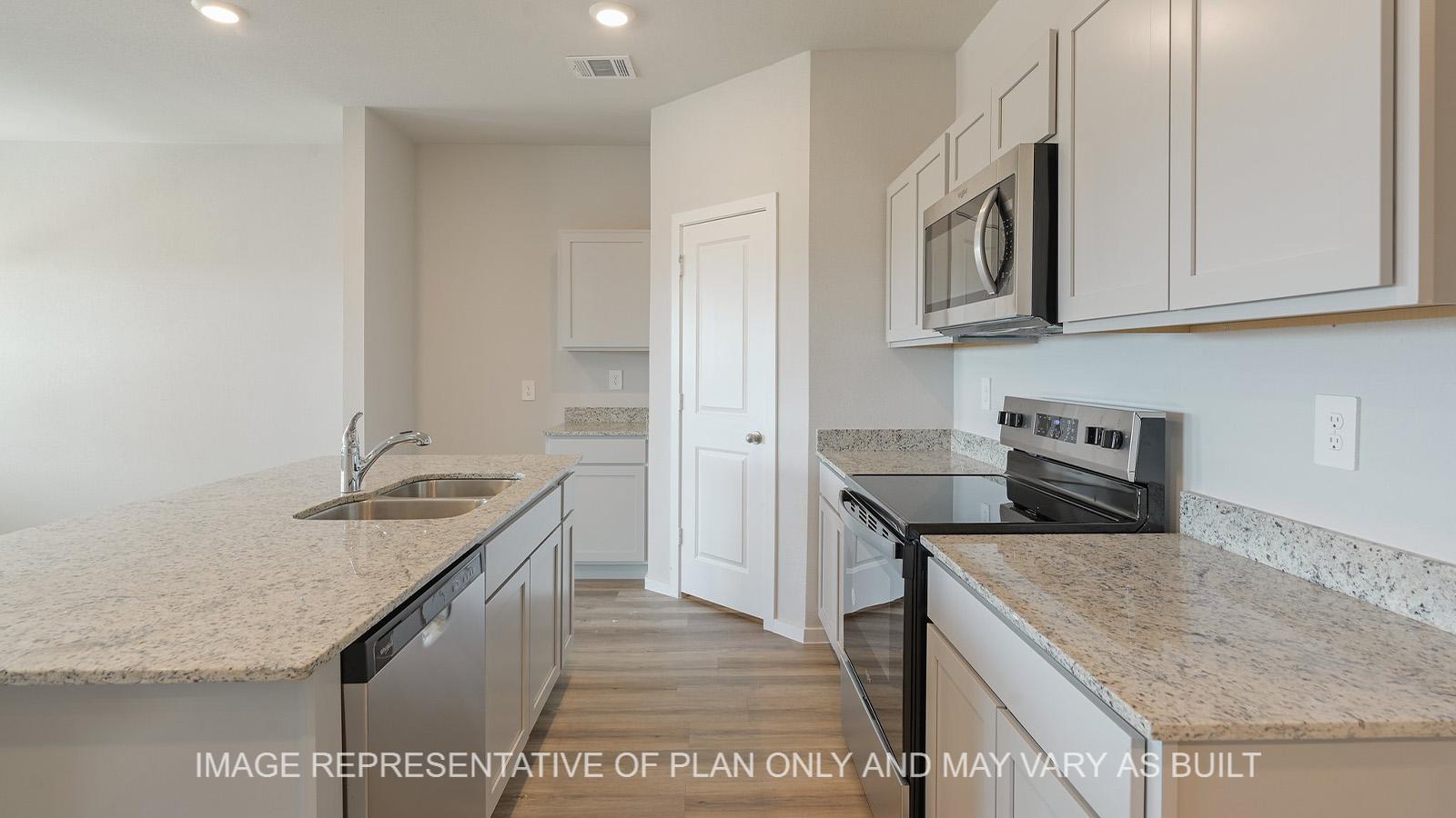 Midland kitchen with gray cabinetry, granite countertops, and vinyl plank flooring.