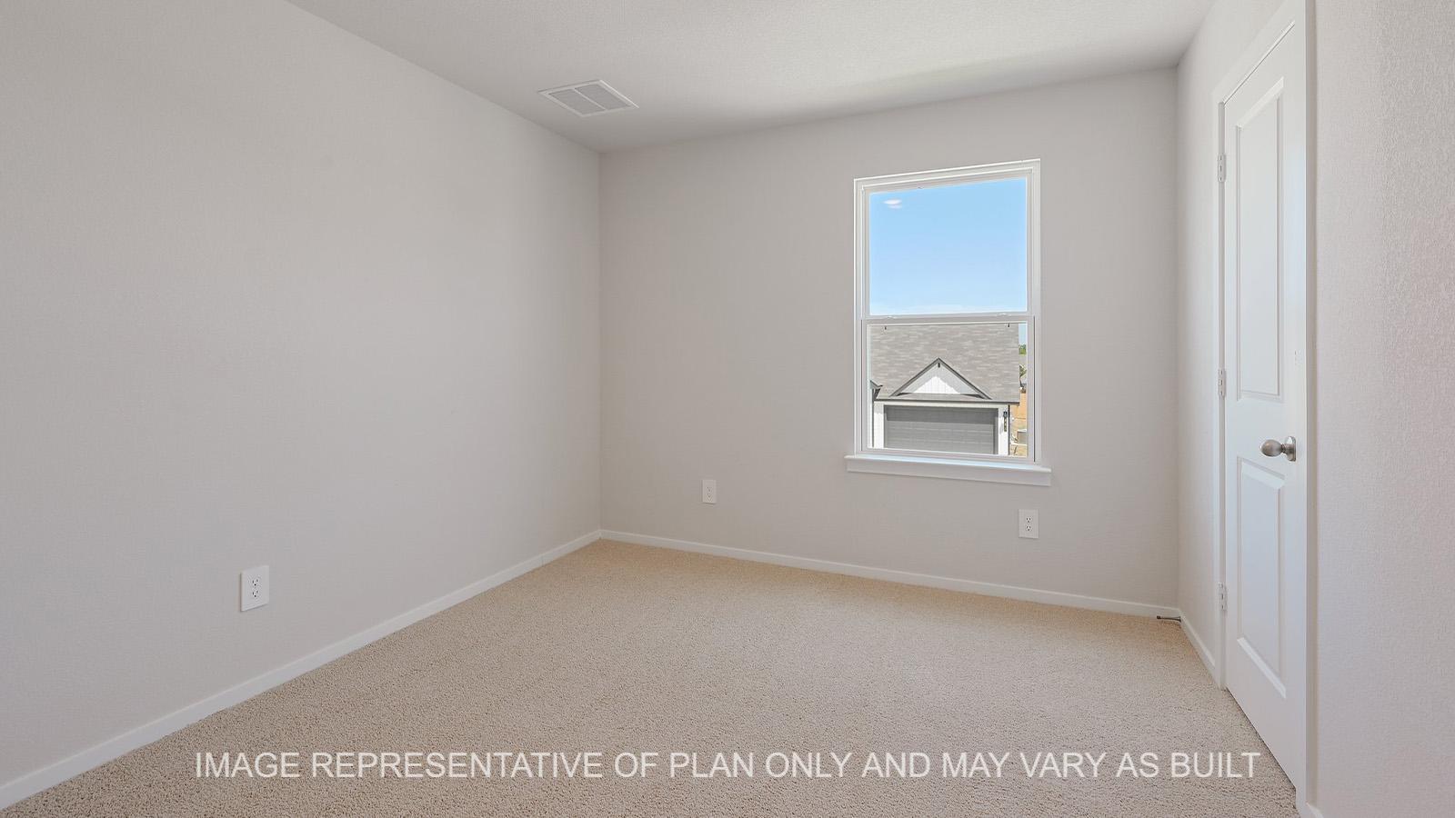Midland secondary bedroom with window and carpeted flooring.