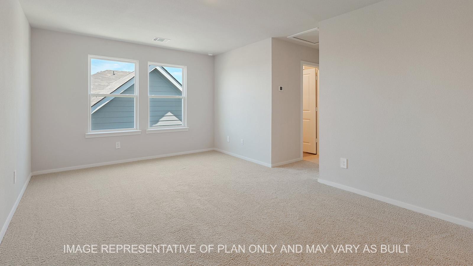 Midland upstairs loft with windows and carpeted flooring.